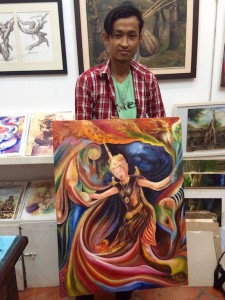 Artist/teacher Sokoun with one of his works
